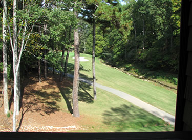 View of the golf course and stream from the deck.