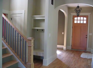 Foyer, stairs and custom bench.